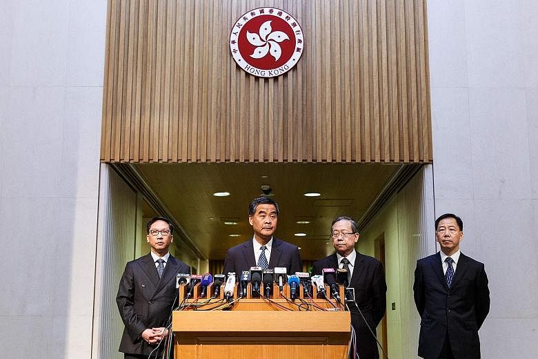 Facing the media yesterday were (from left) Justice Minister Rimsky Yuen, Mr Leung, Security Minister Lai Tung Kwok and acting police commissioner Tony Wong.