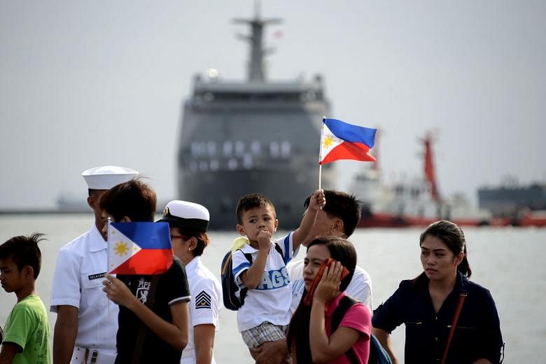 Relatives of the crew of the Philippine navy's BRP Tarlac out to welcome the arrival of the first strategic sealift vessel in Manila in May. The BRP Tarlac will serve as the navy's floating command and control ship as the country modernises its fleet amid