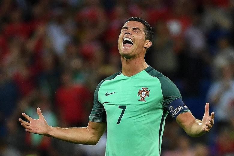 Cristiano Ronaldo of Portugal celebrates the 2-0 win against Wales on Wednesday. The side, coached by Fernando Santos since September 2014, have not lost a game at Euro 2016 and are now unbeaten in 13 competitive encounters.