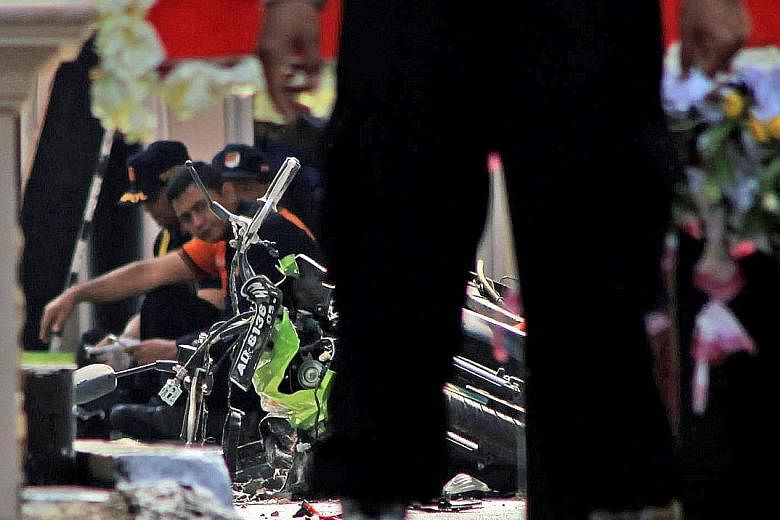 The scene of a suicide bomb attack at a police station in Solo, Indonesia, on Tuesday. The more ISIS comes under siege in the Middle East, the more it will be motivated to strike targets outside the region, says the writer.