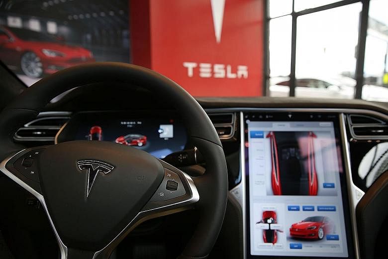 The view from inside a Tesla vehicle, as it is parked in a showroom in Brooklyn, New York City.