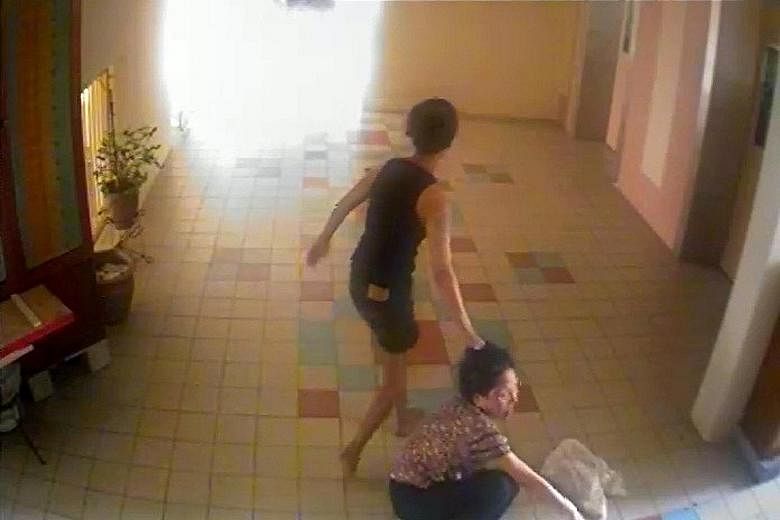 Ng (far right) was caught on video assaulting Madam Toh (above). She rained punches on the elderly woman and dragged her by the hair across the floor, among other things.