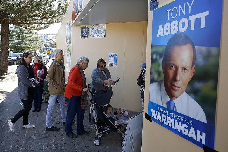 Voters in Mr Tony Abbott's electorate on Polling Day last Saturday. Tensions between Mr Abbott and Prime Minister Malcom Turnbull have been simmering for decades.