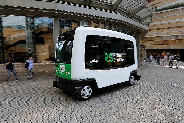 Japan's Internet provider DeNA's Robot Shuttle, a self-driving bus, during a demonstration ride. Although some Tesla drivers rave about the Autopilot feature, more conventional carmakers have designed their systems to take control of the car for only