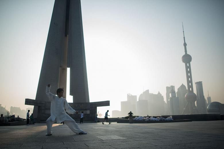 A man exercising against a backdrop of the Lujiazui financial district in Shanghai. Countries in the region recognise the power of the Chinese economy and prefer to work with Beijing despite differences in other areas of their relationships. 