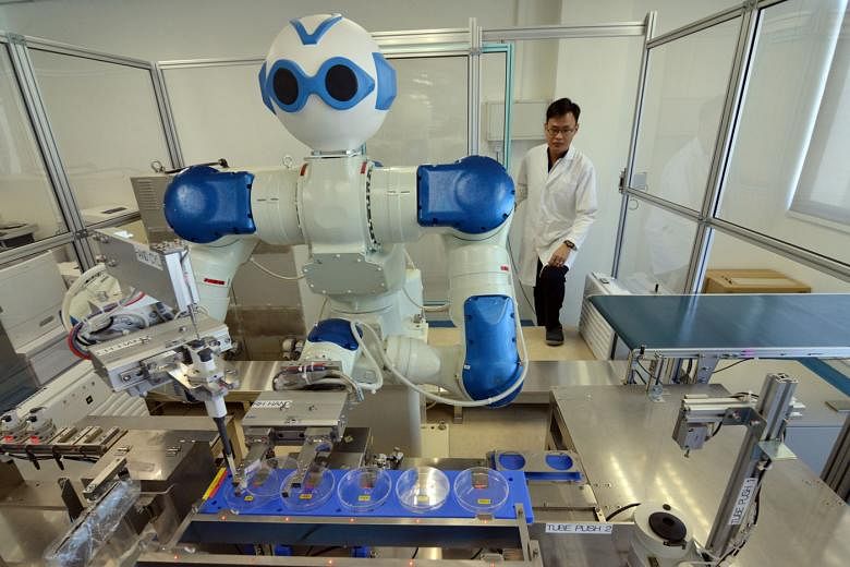  Above: Microbiological testing laboratory Ugene Laboratory Services invested in a $1.5 million robot to do routine tasks like weighing samples and to conduct simple tests for bacteria like E. coli. 