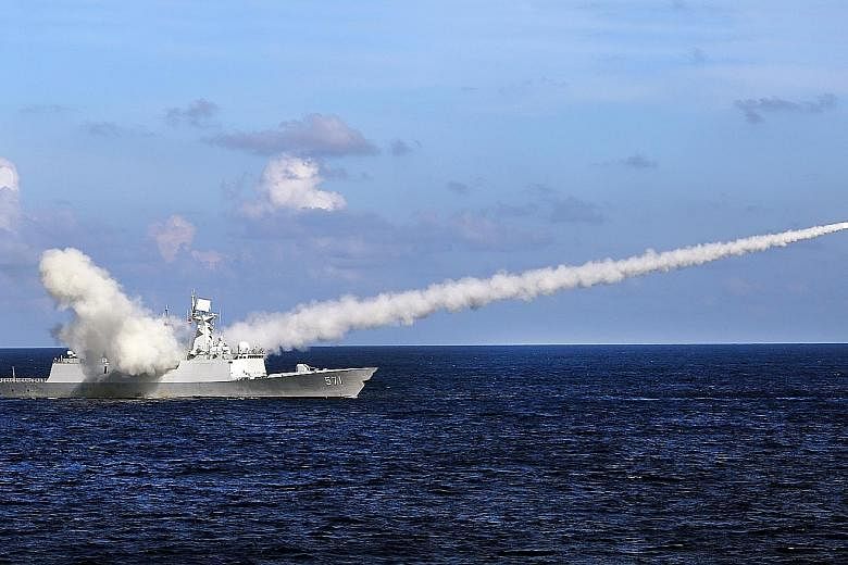 Frigate Yuncheng launching an anti-ship missile on Friday. China is conducting military exercises around the disputed Paracel Islands in the north of the South China Sea that will end tomorrow.
