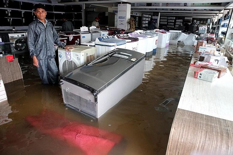 An electronic appliances shop in Bhopal, Madhya Pradesh, flooded after heavy rains on Saturday. The state had also been among the worst drought-affected areas in India.
