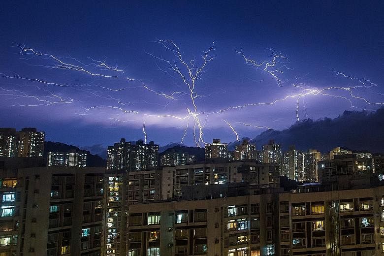 Hong Kong's weather photographers had a field day over the weekend snapping pictures of forks of lightning piercing the deep purple skies.