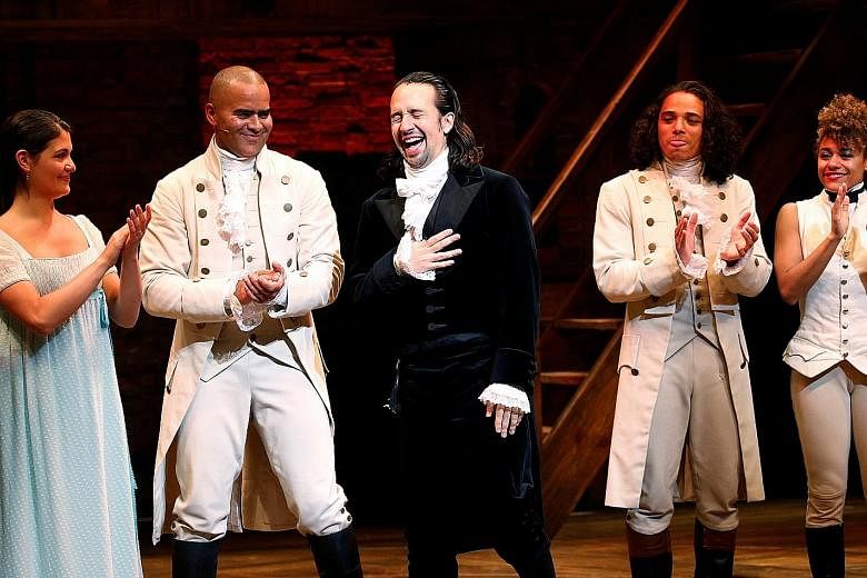 Actor Lin-Manuel Miranda (above right) at his last performance, with fellow cast members Phillipa Soo and Christopher Jackson.