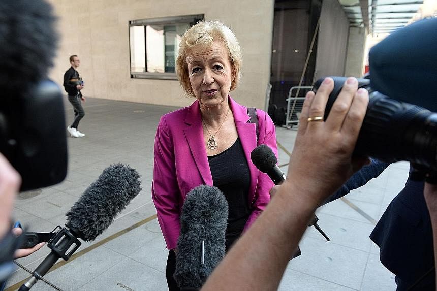 Mrs May, set to become Britain's second female prime minister, at Birmingham's Institute of Engineering and Technology yesterday. In a speech, she called for "a country that works for everyone, not just the privileged few". Mrs Leadsom said a nine-we