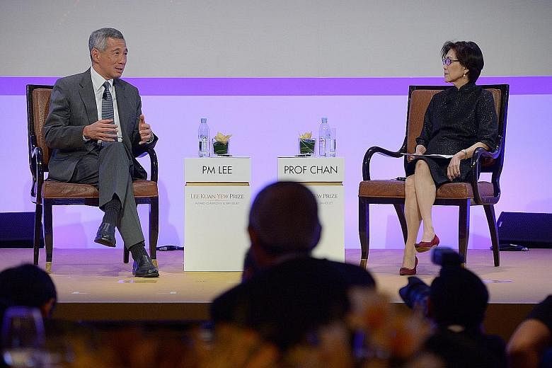 PM Lee and Ambassador-at-Large Chan Heng Chee at last night's dialogue. Prof Chan, chairman of the Lee Kuan Yew Centre for Innovative Cities at the Singapore University of Technology and Design, was the moderator.