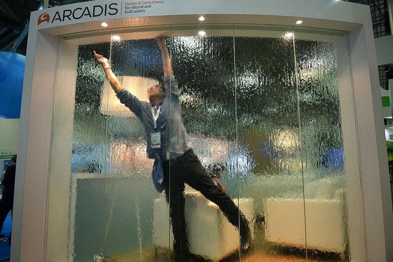 The Arcadis design and consultancy firm's exhibit at the City Solutions Singapore exhibition at the Sands Expo and Convention Centre yesterday. The exhibition is part of the ongoing World Cities Summit, Singapore International Water Week and CleanEnv