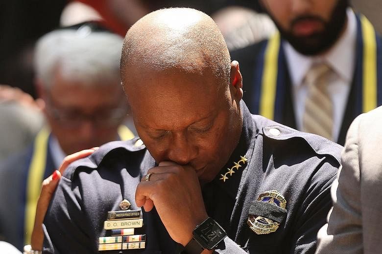 Dallas police chief David Brown attending a prayer vigil last Friday. In 2010, his son fatally shot an officer and another man while high on drugs, before being killed by police.
