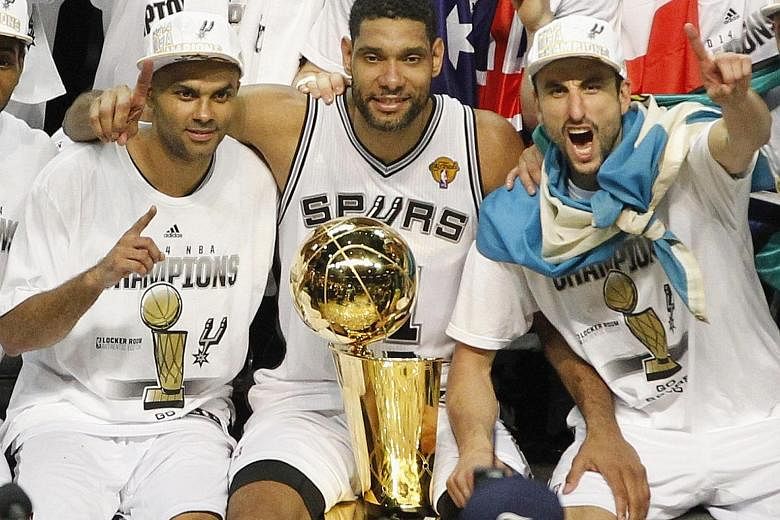 Tim Duncan's (centre) retirement will break up the San Antonio Spurs' Hall of Fame trio of him, Tony Parker (left) and Manu Ginobili, seen here with the Larry O'Brien trophy after the Spurs defeated the Miami Heat to clinch their last NBA championshi