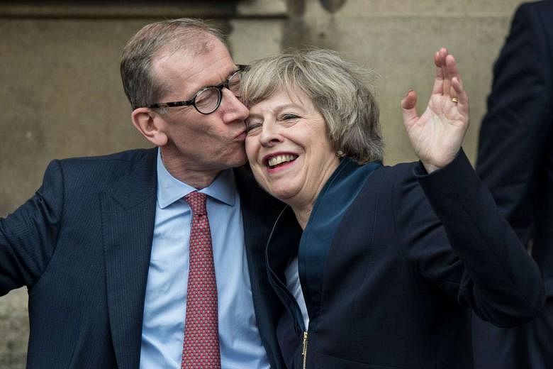 Mrs May getting a kiss from her husband Philip on Monday after becoming the new Conservative Party leader. She held the post of Home Secretary for six years - making her Britain's longest-serving interior minister since 1892. 