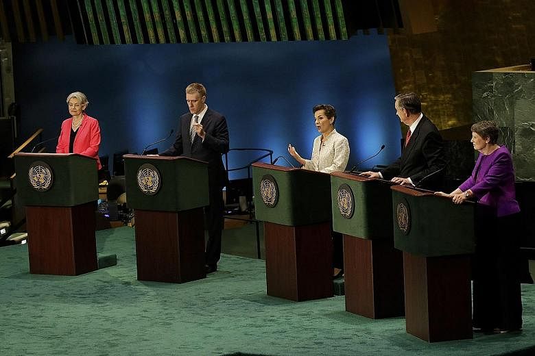 UN Secretary-General candidates (from left) Ms Irina Bokova, Mr Igor Luksic, Ms Christiana Figueres, Mr Danilo Turk, former president of Slovenia, and Ms Helen Clark at a townhall meeting on Tuesday. Two debates - with five candidates in each group -