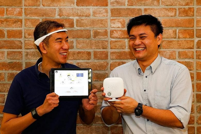 Dr Chan (left) wears Neeuro's SenzeBand on his head. It can detect brainwaves, allowing him to control his brain activity to play games meant to improve memory, spatial skills and other cognitive functions. Dr Tan's SoundEye Ark device was originally