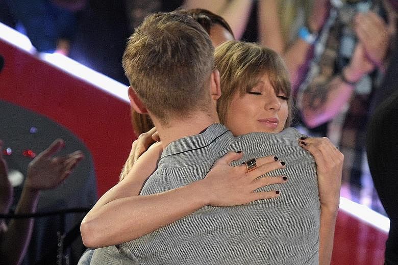 Calvin Harris tweeted that ex-girlfriend Taylor Swift is trying to make him look bad. Both are seen here at the iHeartRadio Music Awards in Inglewood, California, in April before they broke up.