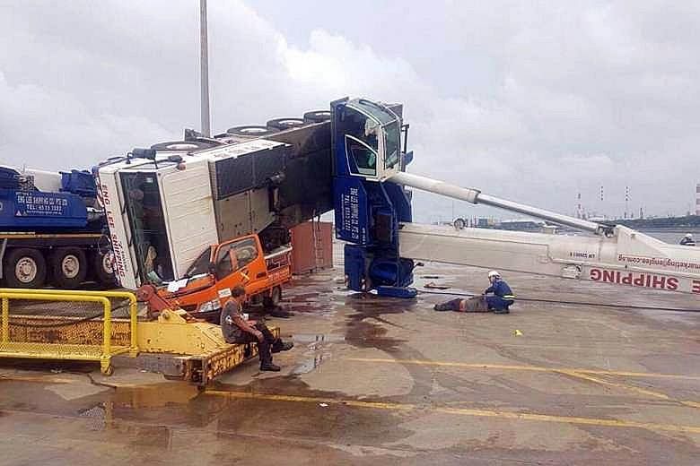 A crane collapsed onto a lorry at Jurong Port yesterday afternoon, injuring two people. The Singapore Civil Defence Force (SCDF) said it was alerted to the incident at 37, Jurong Port Road at 3.20pm. It dispatched two ambulances to the scene. A man i