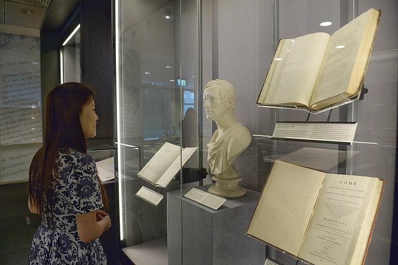 Items displayed during a media preview of the Rare Gallery yesterday included a 1923 text by Dr John Gimlette titled Malay Poisons And Charm Cures (above) and a bust of Raffles alongside letters he wrote to his cousin describing how well Singapore wa