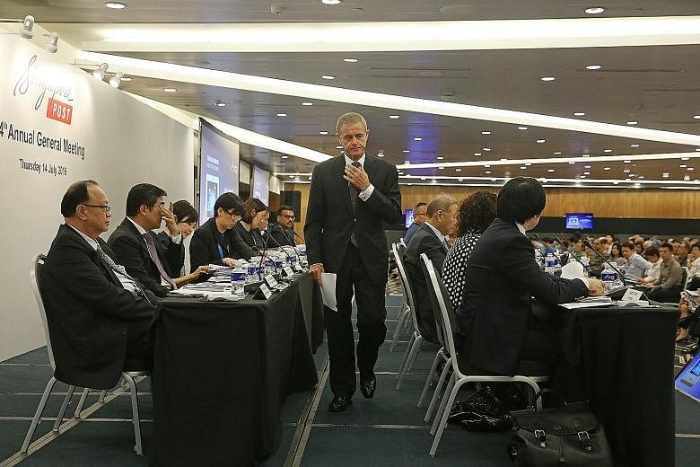 SingPost chairman Simon Israel preparing to deliver his speech at its 24th annual general meeting held yesterday at Suntec City Convention and Exhibition Centre. The meeting dragged into a three-hour affair as Mr Israel took pains to clear the air ov