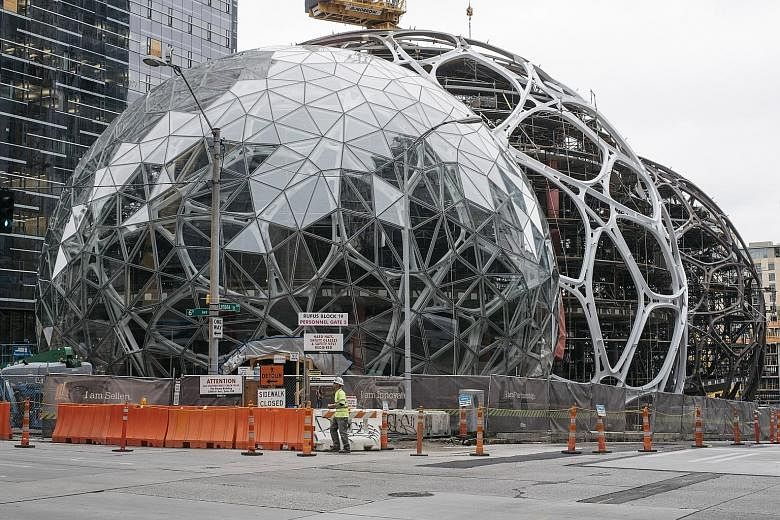 A rendering of the interior (above) of the spheres (left) in Amazon's upcoming complex in Seattle.