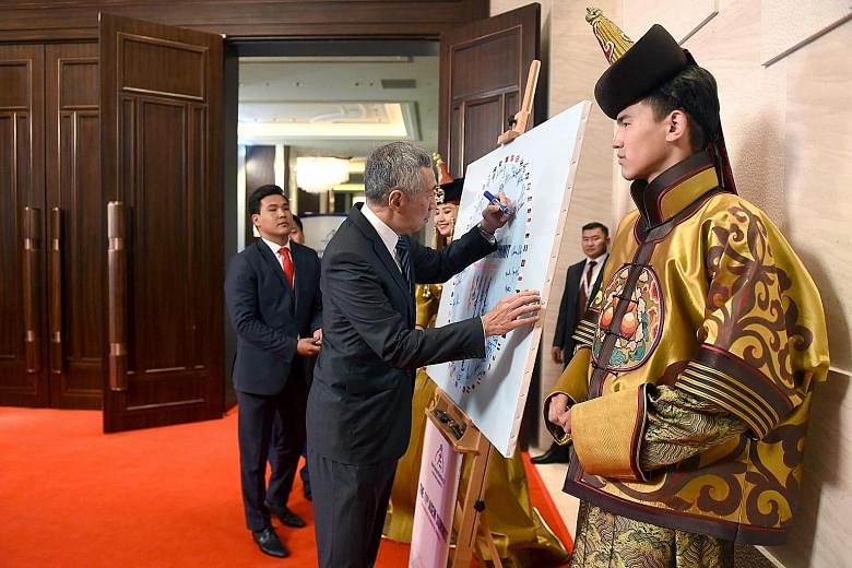 Above: PM Lee Hsien Loong and Mrs Lee with a brown horse. President Tsakhiagiin Elbegdorj of Mongolia presented visiting leaders with a horse each, and Mr Lee named the horse Bintang Temasek (Star of Temasek). However, he will not be bringing it back