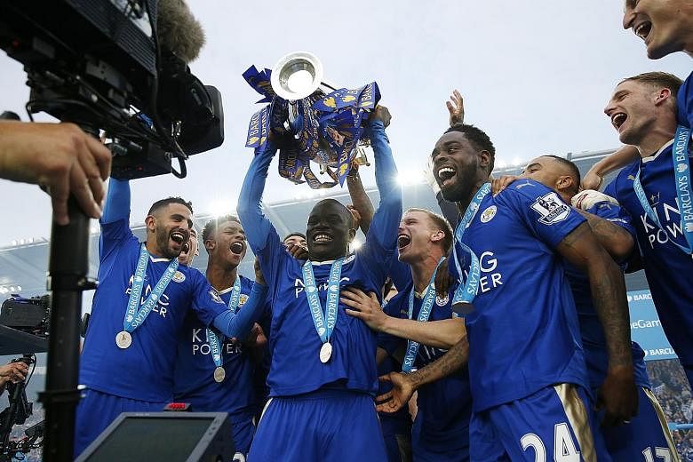 N'Golo Kante lifting the trophy with his Leicester City team-mates as they celebrate winning the English Premier League last season.