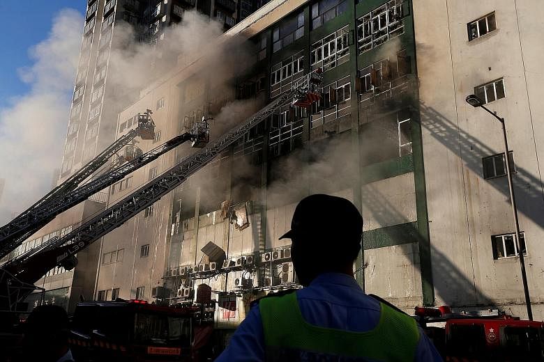 A burning industrial building in Hong Kong on June 23. The fire burned for 108 hours, killing two firemen. Demand for storage facilities in space- constrained Hong Kong has caused the storage trade to grow by about 41 per cent in the past three years