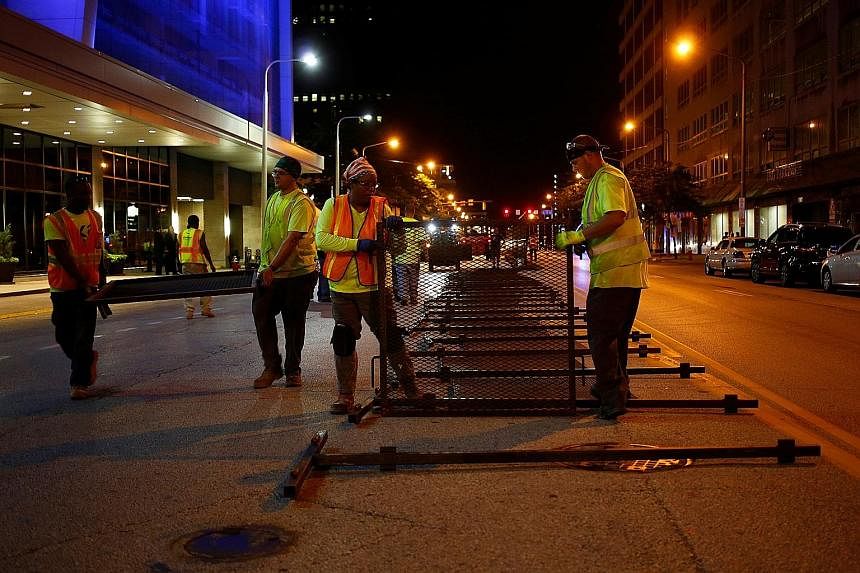 Workers erecting security barricades last week ahead of the convention, which will be missing some of the major names who normally grace these events. Actor Antonio Sabato Jr is the sole actor in the celebrity line-up. Mr Peter Thiel, a co-founder of