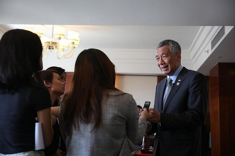 Mr Lee being interviewed yesterday by Singapore reporters in Mongolia. He was in the country for a four-day official visit and met European leaders during the two-day Asia-Europe Meeting Summit.