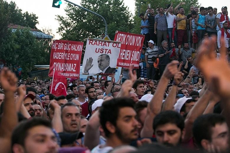 Pro-Erdogan supporters at a rally near the Turkish President's house in Istanbul last Saturday after the Turkish authorities wrested back control of Ataturk airport.