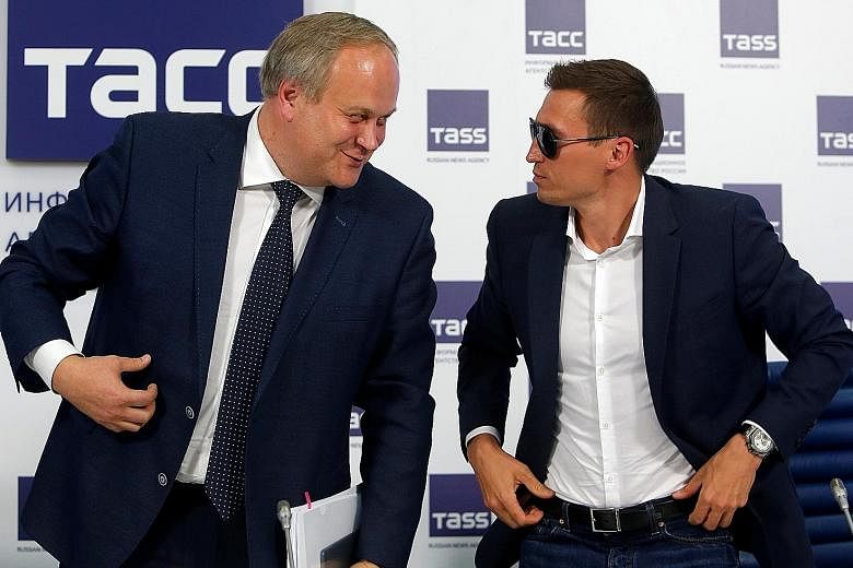 Gold medallist cross-country skier Alexander Legkov (right) at a May 13 news conference in Moscow to rebut claims that he was one of the Russians at the 2014 Sochi Winter Olympics who doped. With him is Russian Deputy Sports Minister Yuri Nagornykh, 