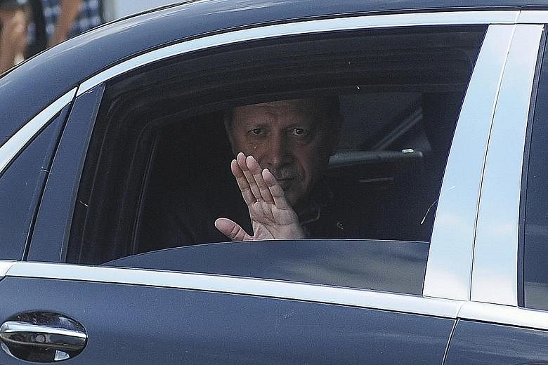 Turkish President Recep Tayyip Erdogan making his way to a funeral service in Istanbul yesterday for victims of the thwarted coup.
