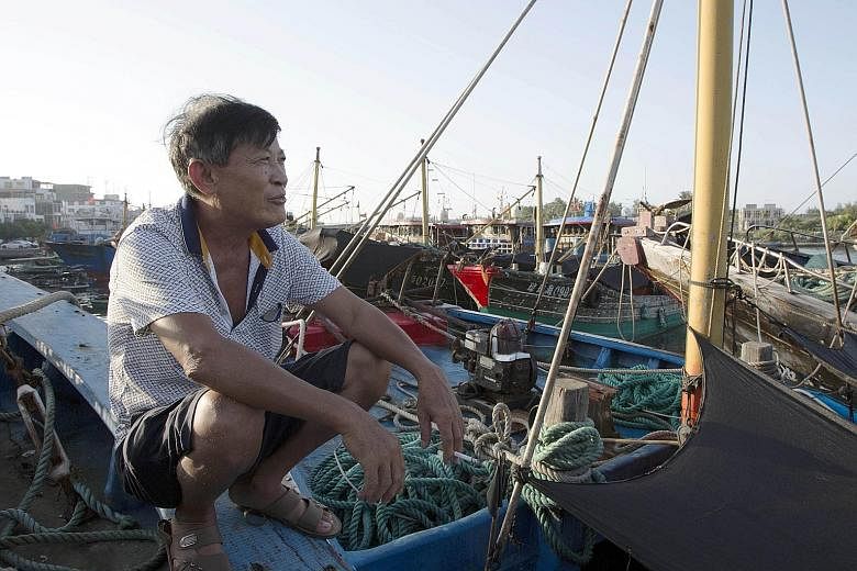 Fisherman Fu Zhongzheng, 68, on China's Hainan Island preparing to sail into the South China Sea, despite an arbitral tribunal ruling last week that struck down China's historical claims to most of the maritime region. The determination of both Chine