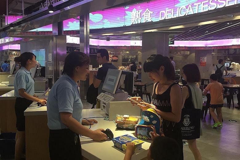 Customers of this new supermarket in Shanghai must use Alipay, Alibaba's online payment platform, for their purchases.