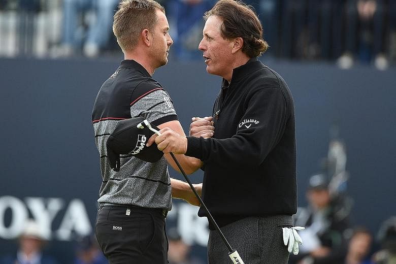 Mickelson (right) congratulating Stenson after the latter won the British Open at Royal Troon, Scotland, on Sunday.