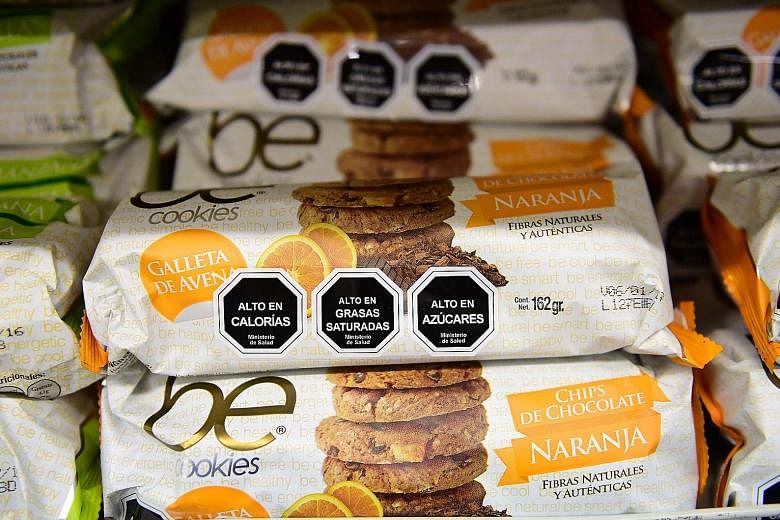 Cookies with labels stating their high content of sugar, calories and saturated fat in Santiago, Chile.