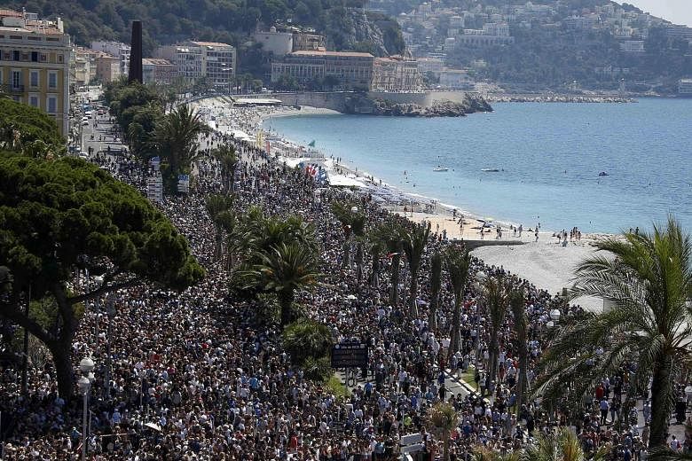 A sea of people thronging the beach promenade in the French Riviera city of Nice for an emotional minute's silence yesterday, four days after a Tunisian attacker drove a truck into a crowd at the same place on France's national day, killing 84 people