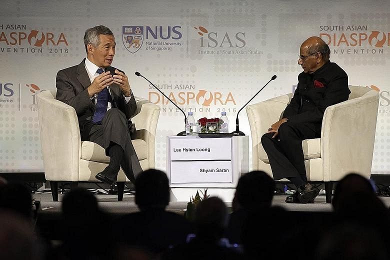 PM Lee speaking at the South Asian Diaspora Convention's gala dinner yesterday. The dialogue was moderated by Mr Shyam Saran, the former foreign secretary of India.
