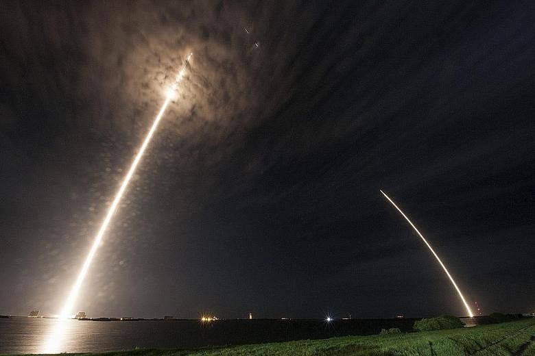 The SpaceX Falcon 9 rocket and Dragon spacecraft lifting off from Cape Canaveral Air Force Station yesterday. The main section of the Falcon 9 rocket later separated from the Dragon spacecraft and flew itself back to the ground.