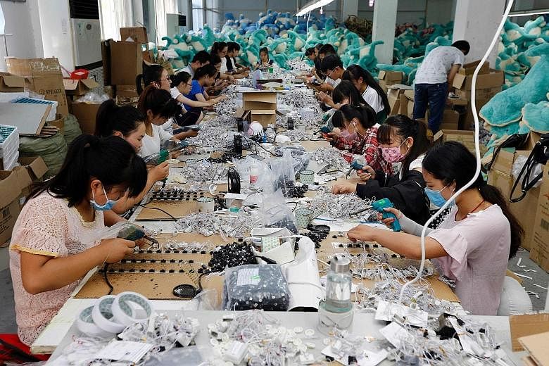 Workers making soft toys at a factory in Lianyungang, in eastern China's Jiangsu province. SCCCI president Thomas Chua says the challenge for Singapore firms is to devise a business model to match China's changing economic landscape. He also sees opp