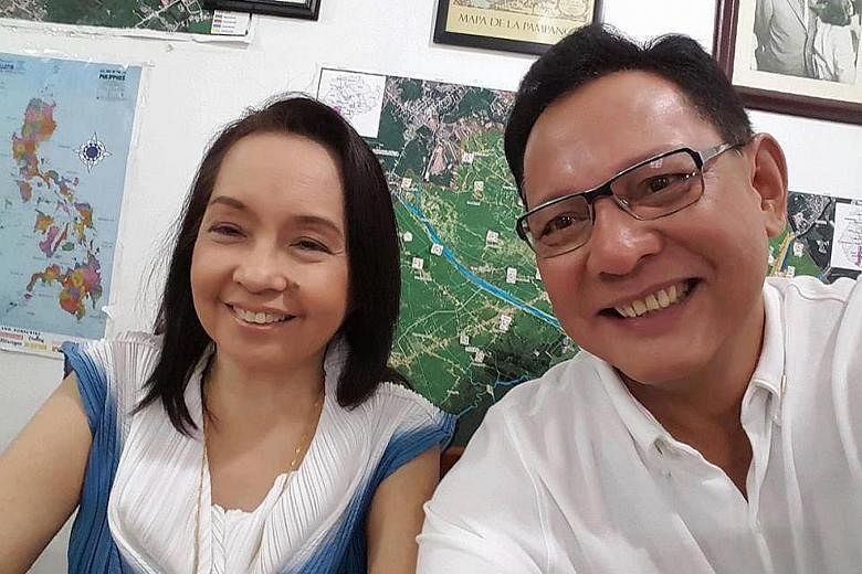 Mrs Arroyo with her lawyer, Mr Raul Lambino, in an undated selfie. She has been cleared of stealing $12.2 million from the state lottery firm when she was president of the Philippines from 2004 to 2010.