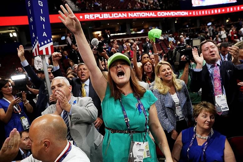A delegate from Virginia opposing a roll-call vote on the first day of the Republican National Convention on Monday. More than once, the delegates on the floor broke into deafening boos and chants as pro- and anti-Trump forces faced off in a shouting