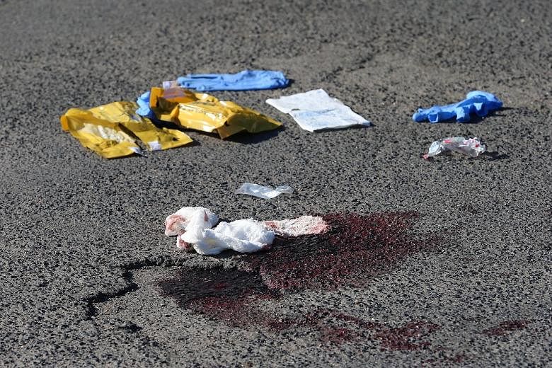 A pavement near Wuerzburg yesterday after Monday's train attack. The Afghan teen, wielding an axe and knife, seriously injured four Hong Kong tourists. Other passengers suffered minor injuries.