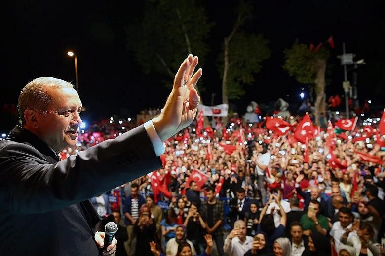 President Erdogan at a midnight rally in Istanbul on Monday. The Turkish leader and government accuse US-based Mr Gulen of orchestrating last Friday's abortive military takeover. The subsequent and ongoing crackdown, and calls to reinstate the death 