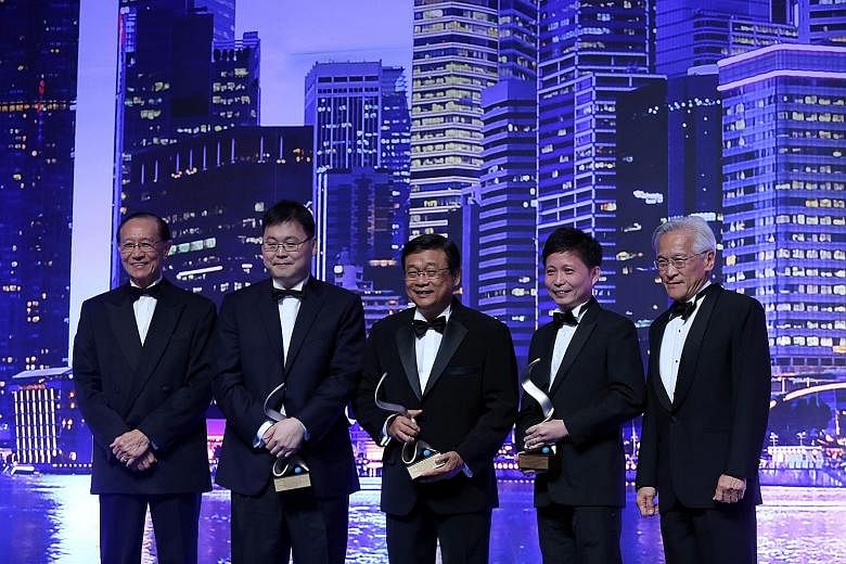 At the awards last night were (from left): presenter John Lim, immediate past chairman of the Singapore Institute of Directors, Best CEO winners William Liem, Lim Ee Seng and Kong Chee Min; and presenter Chew Choon Seng, chairman of Singapore Exchang