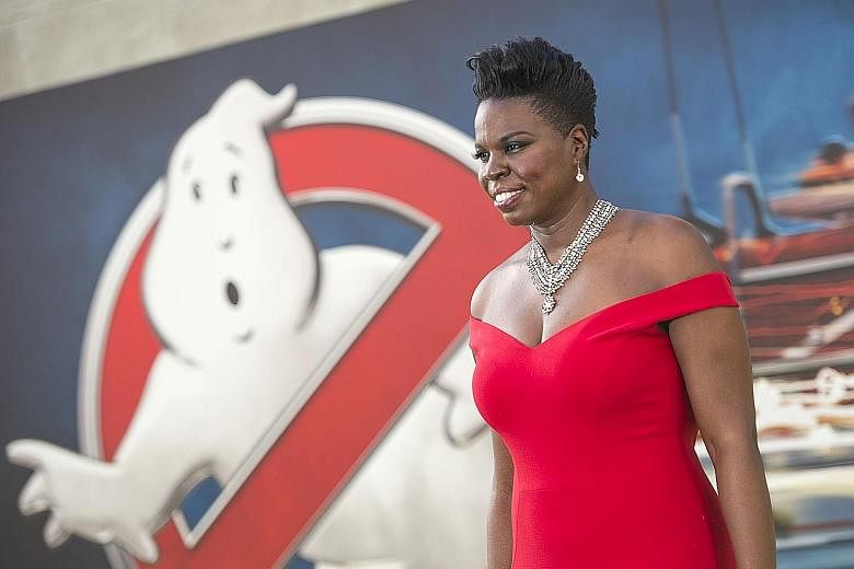Breitbart news editor Milo Yiannopoulos (above) is accused of leading an online campaign of racial and sexual taunts against Ghostbusters star Leslie Jones (left).