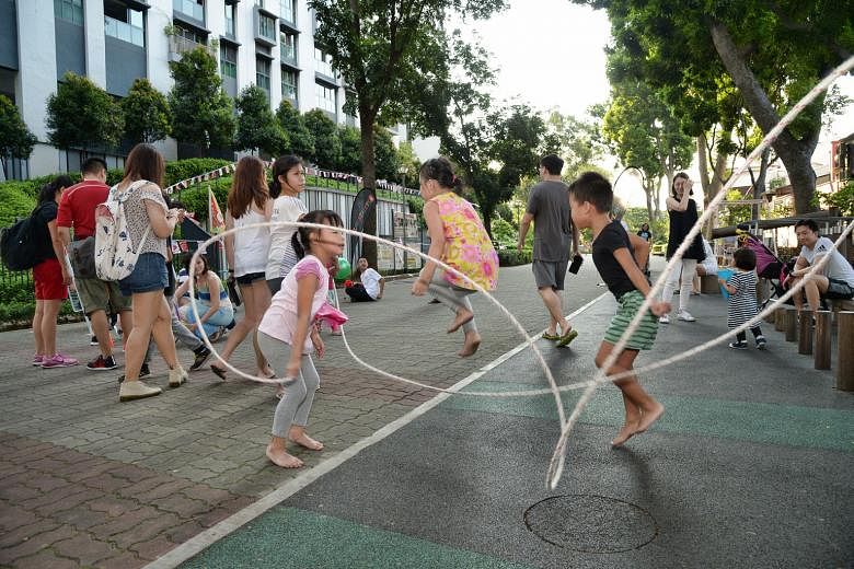 Children jumping rope in Duxton Plain at the PlaystreetsSG event last weekend. The initiative by the Singapore Wellness Association aims to get people moving by turning neighbourhood streets into giant playgrounds.